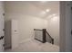Hallway with staircase, neutral walls, and storage at 485 Washington St, Fortville, IN 46040