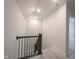 Upstairs hallway with staircase, neutral walls, and natural light at 485 Washington St, Fortville, IN 46040