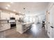 Modern kitchen featuring a center island, stainless steel appliances, and light gray floors at 485 Washington St, Fortville, IN 46040
