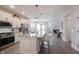 Spacious kitchen with gray floors, granite countertops, and stainless steel appliances at 485 Washington St, Fortville, IN 46040