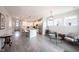 Expansive open-concept living space features a cozy living room next to a modern kitchen with an island at 485 Washington St, Fortville, IN 46040