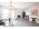 Inviting living area featuring natural light and neutral furnishings, alongside a stone fireplace and entertainment center at 485 Washington St, Fortville, IN 46040