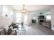 Comfortable living area boasts lots of natural light, neutral furnishings, and a cozy atmosphere with a stone fireplace at 485 Washington St, Fortville, IN 46040