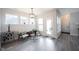Cozy living room filled with natural light, features neutral tones and access to the outdoor patio at 485 Washington St, Fortville, IN 46040