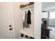 Mud room with bench, storage cubbies, hooks, and door to exterior at 485 Washington St, Fortville, IN 46040