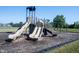 Community playground featuring multiple slides and swings surrounded by a safety surface at 485 Washington St, Fortville, IN 46040