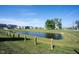 Scenic community pond with green surroundings and well-maintained landscaping on a sunny day at 485 Washington St, Fortville, IN 46040