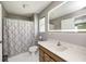 Bathroom featuring a vanity, a decorative shower curtain, and a well-lit mirror at 494 W Greencastle Rd, Mooresville, IN 46158