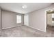Neutral bedroom with soft carpeting, ample light, and standard closet at 494 W Greencastle Rd, Mooresville, IN 46158