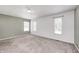 Bright bedroom with soft carpeting, large windows, and neutral wall tones at 494 W Greencastle Rd, Mooresville, IN 46158