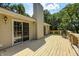 A spacious wooden deck with sliding glass doors offers outdoor relaxation and entertainment space at 494 W Greencastle Rd, Mooresville, IN 46158