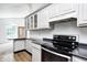 Charming kitchen showcasing sleek countertops and stainless steel appliances with dining area at 494 W Greencastle Rd, Mooresville, IN 46158