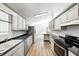 Bright kitchen featuring sleek countertops, white cabinets, and stainless steel appliances at 494 W Greencastle Rd, Mooresville, IN 46158