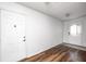 Living room features wood floors, white walls and trim, and two white doors at 494 W Greencastle Rd, Mooresville, IN 46158