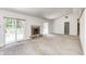 Spacious living room featuring a fireplace and sliding glass doors leading to the backyard at 494 W Greencastle Rd, Mooresville, IN 46158
