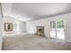 Bright living room with cozy fireplace and natural light from sliding glass doors at 494 W Greencastle Rd, Mooresville, IN 46158