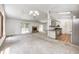 Open living space features fireplace, vaulted ceilings and kitchen with stainless appliances at 494 W Greencastle Rd, Mooresville, IN 46158