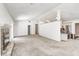 Open-concept living space, with fireplace, vaulted ceilings, and a partial view of kitchen at 494 W Greencastle Rd, Mooresville, IN 46158