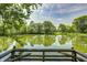 A serene pond surrounded by lush greenery provides a tranquil escape for relaxation and reflection at 494 W Greencastle Rd, Mooresville, IN 46158