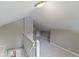 Finished attic includes carpet, light-colored paint, and a white banister at 5209 E North St, Indianapolis, IN 46219