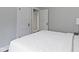 Bedroom with neutral walls, bright white trim, and view of hall closet at 5209 E North St, Indianapolis, IN 46219