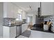 Well-appointed kitchen with stainless appliances, granite counters, and white cabinetry at 5209 E North St, Indianapolis, IN 46219