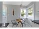 Charming breakfast nook with natural light, modern pendant, and cozy seating at 5209 E North St, Indianapolis, IN 46219