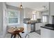 Updated kitchen boasting bright breakfast nook, stainless steel appliances, and custom cabinets at 5209 E North St, Indianapolis, IN 46219