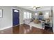 Cozy living room with hardwood floors, a ceiling fan, and neutral decor at 5209 E North St, Indianapolis, IN 46219