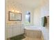 Bright bathroom with a soaking tub, vanity, and floral wallpaper at 5220 Orahood Ct, Plainfield, IN 46168