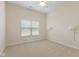Neutral bedroom features carpet, a ceiling fan, and a window with blinds to let natural light in at 5220 Orahood Ct, Plainfield, IN 46168