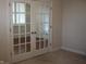 Entryway featuring glass French doors, carpet floors and neutral walls at 5220 Orahood Ct, Plainfield, IN 46168