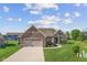 Beautiful single-Gathering home featuring a well-manicured lawn and brick exterior at 5220 Orahood Ct, Plainfield, IN 46168