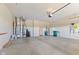Spacious garage featuring a water softener, utility sink, refrigerator and space for waste receptacles at 5220 Orahood Ct, Plainfield, IN 46168
