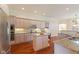 Modern kitchen with granite counters, stainless appliances, hardwood floors, and ample cabinet space at 5220 Orahood Ct, Plainfield, IN 46168