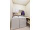 Laundry room with white washer, dryer and cabinets at 5220 Orahood Ct, Plainfield, IN 46168