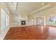 Bright living room featuring a fireplace, ceiling fan, and hardwood floors at 5220 Orahood Ct, Plainfield, IN 46168