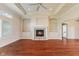 Spacious living room with a stone fireplace and built-in shelving at 5220 Orahood Ct, Plainfield, IN 46168