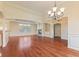 Open-concept living room boasts hardwood floors, fireplace, and archways at 5220 Orahood Ct, Plainfield, IN 46168