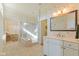 Bright main bathroom featuring a tiled shower, double doors to the main bedroom, and a single vanity at 5220 Orahood Ct, Plainfield, IN 46168