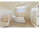 Cozy main bedroom featuring tray ceilings, a ceiling fan, and a private bathroom at 5220 Orahood Ct, Plainfield, IN 46168