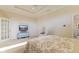 Comfortable main bedroom with a flat screen tv, sitting chair, and private bathroom at 5220 Orahood Ct, Plainfield, IN 46168