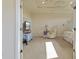 Spacious main bedroom with a tray ceiling, plush carpet, recliner chair, and television at 5220 Orahood Ct, Plainfield, IN 46168