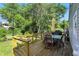 Wooden back deck with outdoor seating and table, ideal for outdoor dining and relaxation at 5312 Norwaldo Ave, Indianapolis, IN 46220