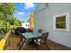 Wooden back deck with outdoor dining and sun umbrella, ideal for entertaining and relaxing at 5312 Norwaldo Ave, Indianapolis, IN 46220