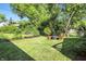 Landscaped backyard with a fire pit area and chairs, perfect for outdoor gatherings at 5312 Norwaldo Ave, Indianapolis, IN 46220