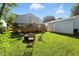 Enjoy the spacious backyard with a wooden deck, a fire pit, and a detached garage at 5312 Norwaldo Ave, Indianapolis, IN 46220