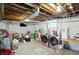 Bright unfinished basement laundry area featuring modern washer and dryer appliances at 5312 Norwaldo Ave, Indianapolis, IN 46220