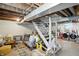 Partially finished basement with laundry area, stairs to upper level, and space for relaxing at 5312 Norwaldo Ave, Indianapolis, IN 46220