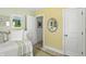 Bright Bedroom featuring a daybed, area rug, and an entrance to an adjoining room at 5312 Norwaldo Ave, Indianapolis, IN 46220